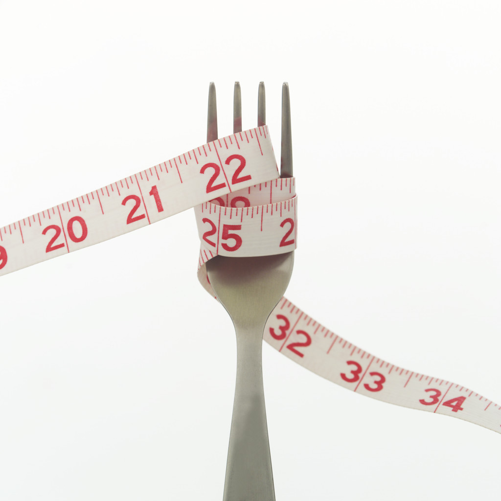 Weight loss goal - measuring tape around fork